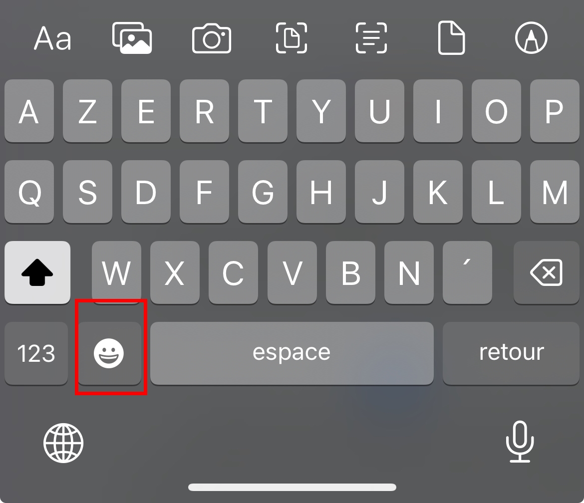 Значок Emoji на клавиатуре для набора текста 