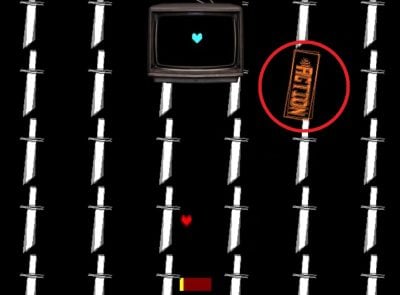 Optagelse fra spillet Undertale, der viser en Action-knap, der dukker op, da det turkise hjerte tager kontrollen.